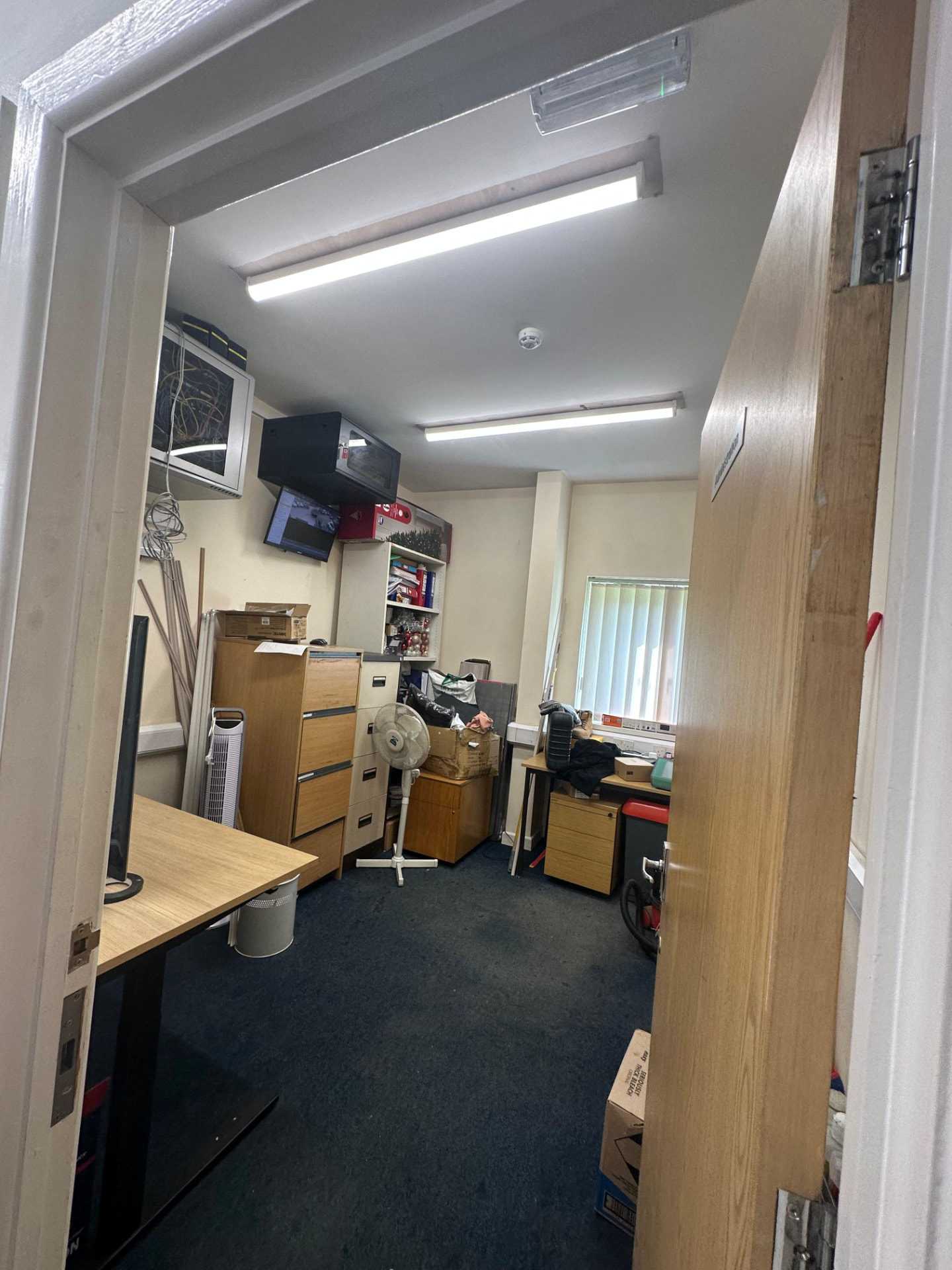 Office fit-out with LED batten lighting installed above workstations