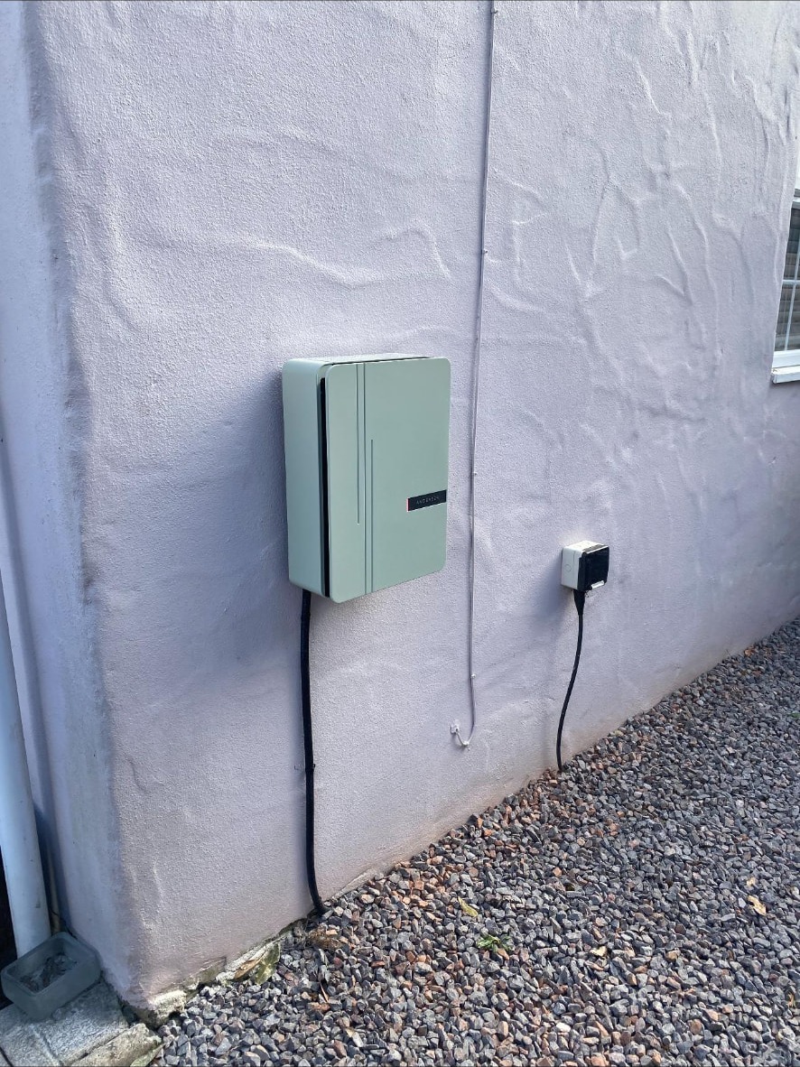Andersen A2 EV charger installed on a rendered wall of a domestic property