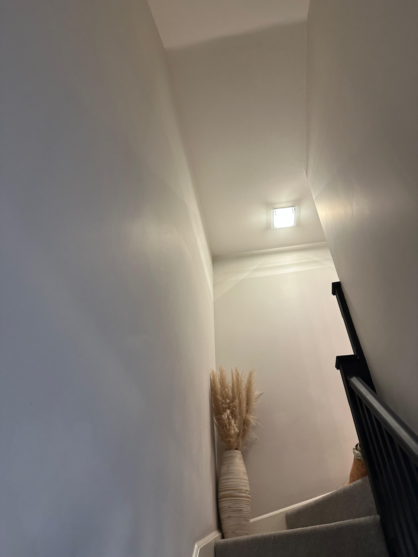 Recessed LED downlight upgrade illuminating a domestic stair and hallway ceiling